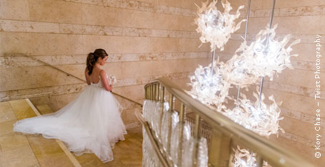 Photograph: Bride descending a fancy staircase
